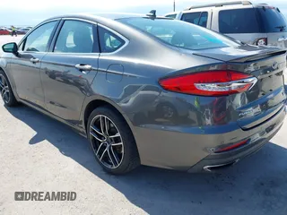 2019 Ford Fusion Titanium with VIN 3FA6P0D91KR104827, listed as a IAAI auction lot 42221526 with 141,316 mi miles and . Bid and sale history available at DreamBid. Image 3.