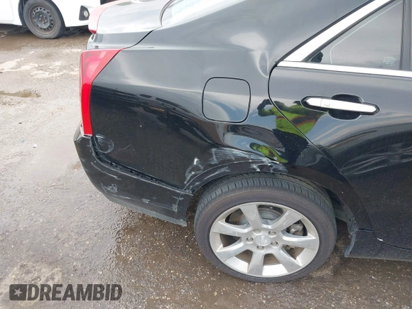 2014 Cadillac ATS Luxury AWD z VIN 1G6AH5R30E0150854, wystawiony jako IAAI lot #42422421 z przebiegiem 96 713 mil mil oraz . Historia ofert i sprzedaży dostępna na DreamBid. Obrazek 6.