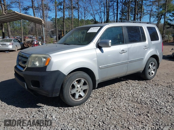 2010 Honda Pilot Touring with VIN 5FNYF4H91AB020868, listed as a IAAI auction lot 41783104 with 298,022 mi miles and . Bid and sale history available at carsss.com. Image 2.