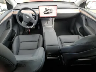 2025 Tesla Model Y Long Range with VIN 7SAYGDED6SF271931, listed as a Copart auction lot 43376015 with 261 mi miles and Salvage Title. Bid and sale history available at DreamBid. Image 8.