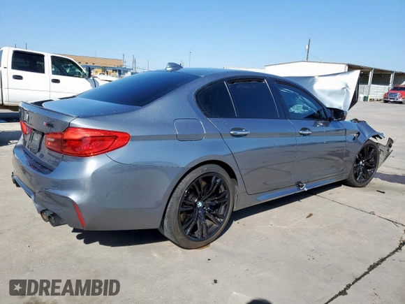 2018 BMW M5 z VIN WBSJF0C50JB282469, wystawiony jako Copart lot #46794335 z przebiegiem Nie podano mil oraz Szkody całkowita. Historia ofert i sprzedaży dostępna na DreamBid. Obrazek 3.