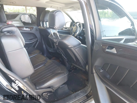 2014 Mercedes-Benz GL 450 z VIN 4JGDF7CE7EA395551, wystawiony jako IAAI lot #42247332 z przebiegiem 105 636 mil mil oraz . Historia ofert i sprzedaży dostępna na DreamBid. Obrazek 8.