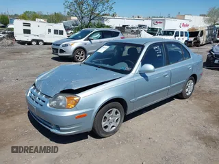 2005 Hyundai Accent GLS with VIN KMHCG45C75U658672, listed as a IAAI auction lot 42107140 with 34,351 mi miles. Bid and sale history available at carsss.com. Image 2.