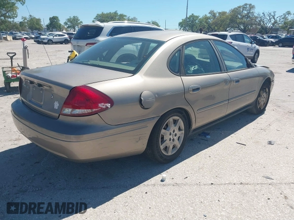 2006 Ford Taurus SE with VIN 1FAFP53U96A223924, listed as a IAAI auction lot 41828443 with 114,653 mi miles. Bid and sale history available at carsss.com. Image 4.