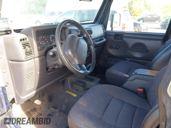 2002 Jeep Wrangler Sport z VIN 1J4FA49SX2P760671, wystawiony jako IAAI lot #41861841 z przebiegiem 125 728 mil mil oraz . Historia ofert i sprzedaży dostępna na DreamBid. Obrazek 5.
