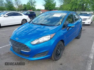 2015 Ford Fiesta SE z VIN 3FADP4BJ6FM125929, wystawiony jako IAAI lot #42181609 z przebiegiem 136 388 mil mil oraz . Historia ofert i sprzedaży dostępna na DreamBid. Obrazek 2.