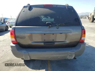 2000 Jeep Grand Cherokee Laredo with VIN 1J4G248S2YC377133, listed as a Copart auction lot 57916785 with 217,525 mi miles and Salvage title. Bid and sale history available at DreamBid. Image 6.