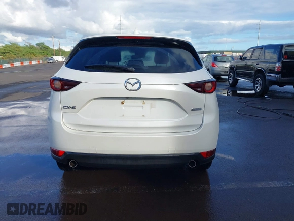 2018 Mazda CX-5 Touring with VIN JM3KFACM1J1431462, listed as a IAAI auction lot 41038099 with 77,489 mi miles. Bid and sale history available at carsss.com. Image 16.
