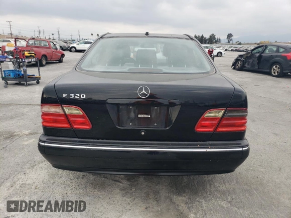 2002 Mercedes-Benz E-Class with VIN WDBJF65J42B486633, listed as a Copart auction lot 76979054 with 151,429 mi miles and Salvage Title. Bid and sale history available at carsss.com. Image 6.