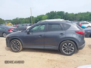 2016 Mazda CX-5 Grand Touring z VIN JM3KE2DY5G0801238, wystawiony jako IAAI lot #42264694 z przebiegiem 136 993 mil mil oraz . Historia ofert i sprzedaży dostępna na DreamBid. Obrazek 13.