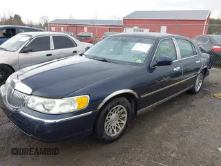 2001 Lincoln Town Car Signature with VIN 1LNHM82W61Y733577, listed as a IAAI auction lot 41899175 with 105,083 mi miles and . Bid and sale history available at DreamBid. Image 2.