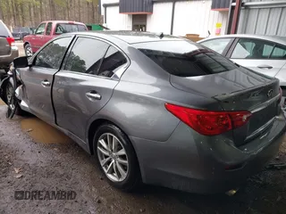 2015 Infiniti Q50 Premium z VIN JN1BV7ARXFM411040, wystawiony jako IAAI lot #41706295 z przebiegiem 97 297 mil mil oraz . Historia ofert i sprzedaży dostępna na DreamBid. Obrazek 3.