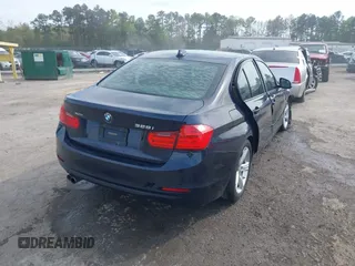 2013 BMW 3 Series 328i xDrive with VIN WBA3B5G53DNS02293, listed as a IAAI auction lot 42012883 with 243,490 mi miles. Bid and sale history available at carsss.com. Image 4.