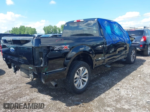 2018 Ford F-150 XL with VIN 1FTEX1EP5JKG01004, listed as a IAAI auction lot 42583232 with 123,258 mi miles and . Bid and sale history available at DreamBid. Image 4.