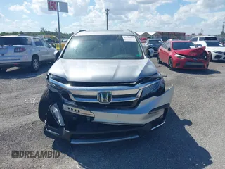 2021 Honda Pilot Touring 8-Passenger with VIN 5FNYF5H99MB041638, listed as a IAAI auction lot 42112915 with 33,230 mi miles and . Bid and sale history available at DreamBid. Image 6.