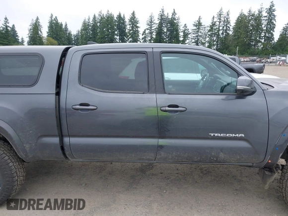 2021 Toyota Tacoma SR5 with VIN 3TMDZ5BN1MM119711, listed as a IAAI auction lot 42479038 with 64,779 mi miles and . Bid and sale history available at DreamBid. Image 14.