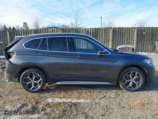 2018 BMW X1 xDrive28i with VIN WBXHT3C33J5F90349, listed as a IAAI auction lot 41385063 with 55,994 mi miles. Bid and sale history available at carsss.com. Image 14.