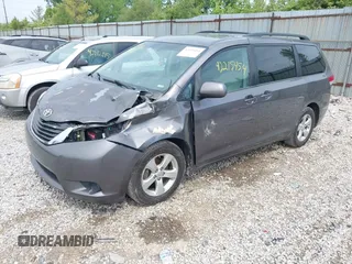 2013 Toyota Sienna LE AAS with VIN 5TDKK3DC0DS301315, listed as a IAAI auction lot 42215454 with 328,507 mi miles and . Bid and sale history available at DreamBid. Image 2.