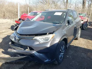 2016 Toyota RAV4 LE with VIN JTMBFREV1GJ085659, listed as a IAAI auction lot 41823575 with 141,657 mi miles. Bid and sale history available at carsss.com. Image 2.