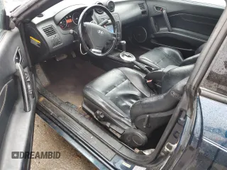 2003 Hyundai Tiburon GT z VIN KMHHN65F13U068658, wystawiony jako Copart lot #81799404 z przebiegiem 163 148 mil mil oraz Szkoda całkowita • Salvage title. Historia ofert i sprzedaży dostępna na DreamBid. Obrazek 8.