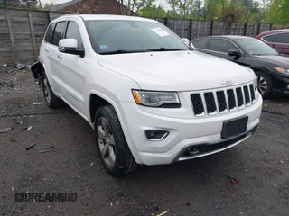 2015 Jeep Grand Cherokee Overland z VIN 1C4RJFCG3FC174247, wystawiony jako IAAI lot #42248344 z przebiegiem 96 975 mil mil oraz . Historia ofert i sprzedaży dostępna na DreamBid. Obrazek 1.
