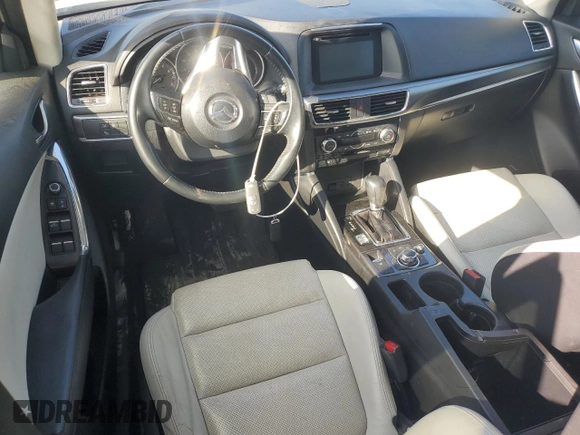 2016 Mazda CX-5 Grand Touring with VIN JM3KE4DY0G0819528, listed as a Copart auction lot 52343885 with 77,340 mi miles and Clean Title. Bid and sale history available at DreamBid. Image 8.