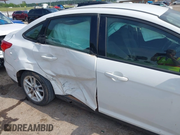 2015 Ford Focus SE with VIN 1FADP3F22FL376042, listed as a IAAI auction lot 42283236 with 76,675 mi miles and . Bid and sale history available at DreamBid. Image 6.