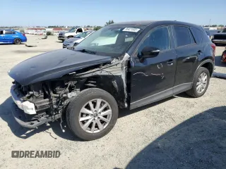 2016 Mazda CX-5 Touring z VIN JM3KE2CY5G0617516, wystawiony jako Copart lot #56421005 z przebiegiem 110 739 mil mil oraz Szkoda całkowita • Salvage title. Historia ofert i sprzedaży dostępna na DreamBid. Obrazek 1.