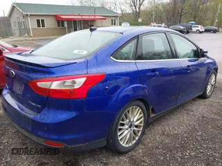 2014 Ford Focus Titanium with VIN 1FADP3J28EL240911, listed as a IAAI auction lot 42082812 with 144,625 mi miles. Bid and sale history available at carsss.com. Image 4.
