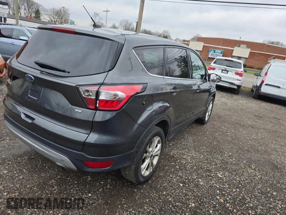2017 Ford Escape SE with VIN 1FMCU9GD4HUB25615, listed as a Copart auction lot 86084664 with 106,034 mi miles and Clean Title. Bid and sale history available at carsss.com. Image 4.