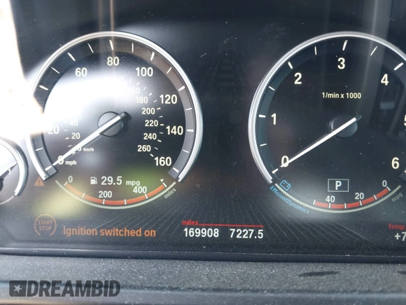 2014 BMW X5 xDrive35d with VIN 5UXKS4C57E0J93982, listed as a IAAI auction lot 42085173 with 169,908 mi miles. Bid and sale history available at carsss.com. Image 7.