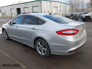 2015 Ford Fusion Titanium Hybrid with VIN 3FA6P0RU8FR181312, listed as a IAAI auction lot 42071584 with 99,955 mi miles. Bid and sale history available at carsss.com. Image 3.