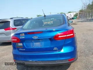 2018 Ford Focus SE z VIN 1FADP3FE1JL254632, wystawiony jako IAAI lot #42408683 z przebiegiem 74 696 mil mil oraz . Historia ofert i sprzedaży dostępna na DreamBid. Obrazek 16.