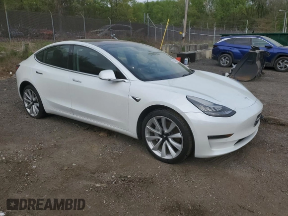 2018 Tesla Model 3 Long Range Battery with VIN 5YJ3E1EAXJF165000, listed as a Copart auction lot 53806195 with 140,448 mi miles and Clean Title. Bid and sale history available at DreamBid. Image 4.