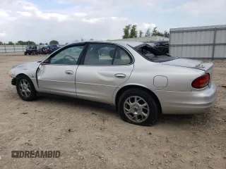 2000 Oldsmobile Intrigue GLS z VIN 1G3WX52H0YF233648, wystawiony jako Copart lot #72619824 z przebiegiem Nie podano mil oraz Nie do naprawy. Historia ofert i sprzedaży dostępna na DreamBid. Obrazek 2.