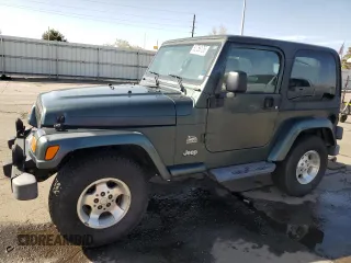 2003 Jeep Wrangler Sahara z VIN 1J4FA59SX3P302622, wystawiony jako Copart lot #52756105 z przebiegiem 181 900 mil mil oraz Szkoda całkowita • Salvage title. Historia ofert i sprzedaży dostępna na DreamBid. Obrazek 1.