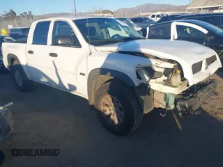 2006 Mitsubishi Raider Duro Cross with VIN 1Z7HC38K36S576409, listed as a IAAI auction lot 41410982 with 152,476 mi miles. Bid and sale history available at carsss.com. Image 1.