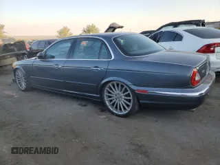 2004 Jaguar XJ with VIN SAJWA73B64TG30921, listed as a Copart auction lot 71267074 with 20,031 mi miles and Salvage Title. Bid and sale history available at carsss.com. Image 2.