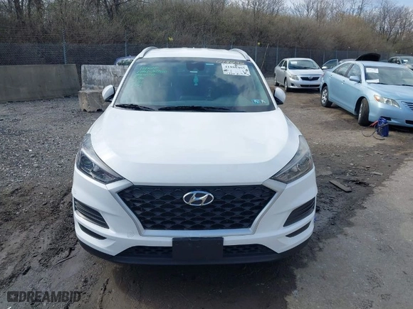 2019 Hyundai Tucson Value with VIN KM8J3CA42KU013032, listed as a IAAI auction lot 41880465 with 51,332 mi miles. Bid and sale history available at carsss.com. Image 12.
