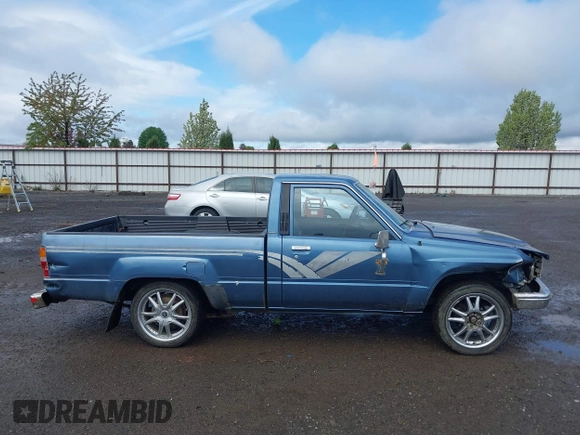 1988 Toyota Pickup with VIN JT4RN50R5J5169942, listed as a IAAI auction lot 42152517 with 218,579 mi miles and . Bid and sale history available at DreamBid. Image 14.