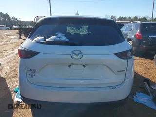 2020 Mazda CX-5 Touring with VIN JM3KFBCM0L0828207, listed as a IAAI auction lot 41305801 with 56,500 mi miles and . Bid and sale history available at DreamBid. Image 16.