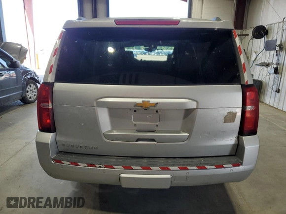 2020 Chevrolet Suburban LT with VIN 1GNSKHKC8LR252336, listed as a Copart auction lot 61094985 with 323,387 mi miles and Clean title. Bid and sale history available at DreamBid. Image 6.