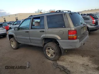 1997 Jeep Grand Cherokee Laredo with VIN 1J4GZ58S1VC741586, listed as a Copart auction lot 77619394 with 0 mi miles and Clean Title. Bid and sale history available at carsss.com. Image 2.