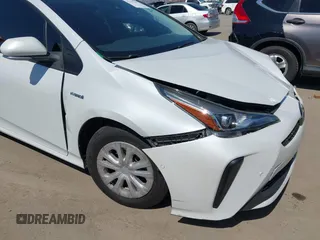 2021 Toyota Prius L Eco with VIN JTDKAMFU8M3135142, listed as a IAAI auction lot 42317007 with 77,353 mi miles and . Bid and sale history available at DreamBid. Image 18.