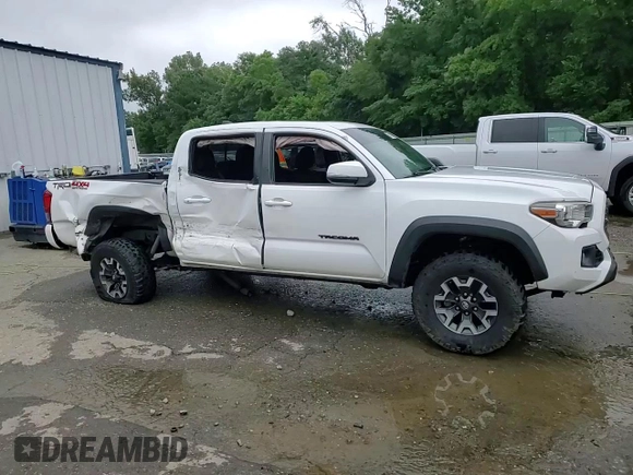 2017 Toyota Tacoma SR5 z VIN 5TFCZ5AN1HX113842, wystawiony jako Copart lot #60711285 z przebiegiem 124 799 mil mil oraz Szkoda całkowita • Salvage title. Historia ofert i sprzedaży dostępna na DreamBid. Obrazek 13.