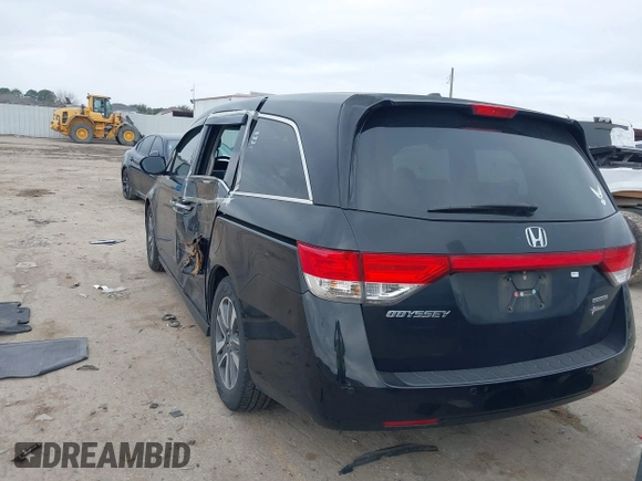 2014 Honda Odyssey Touring with VIN 5FNRL5H9XEB045695, listed as a IAAI auction lot 41545348 with 131,472 mi miles and . Bid and sale history available at carsss.com. Image 3.