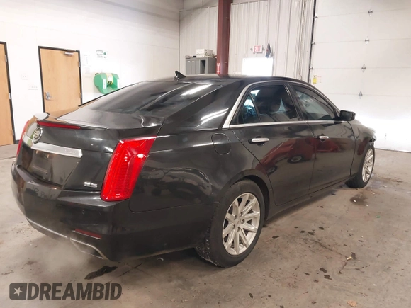 2014 Cadillac CTS Luxury AWD with VIN 1G6AX5S36E0173682, listed as a IAAI auction lot 41538709 with 102,772 mi miles and . Bid and sale history available at DreamBid. Image 4.
