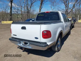 2003 Ford F-150 XLT with VIN 1FTRW07663KD57580, listed as a IAAI auction lot 41870643 with 256,497 mi miles. Bid and sale history available at carsss.com. Image 4.