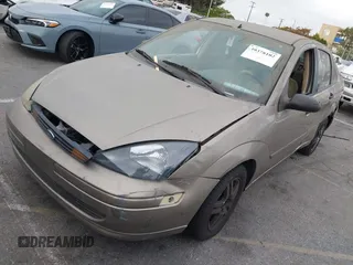 2003 Ford Focus SE z VIN 1FAFP34Z73W236474, wystawiony jako IAAI lot #39378102 z przebiegiem 183 280 mil mil oraz . Historia ofert i sprzedaży dostępna na DreamBid. Obrazek 2.