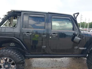 2015 Jeep Wrangler Unlimited Rubicon Hard Rock with VIN 1C4HJWFG0FL674700, listed as a IAAI auction lot 42511949 with 138,370 mi miles and . Bid and sale history available at DreamBid. Image 13.